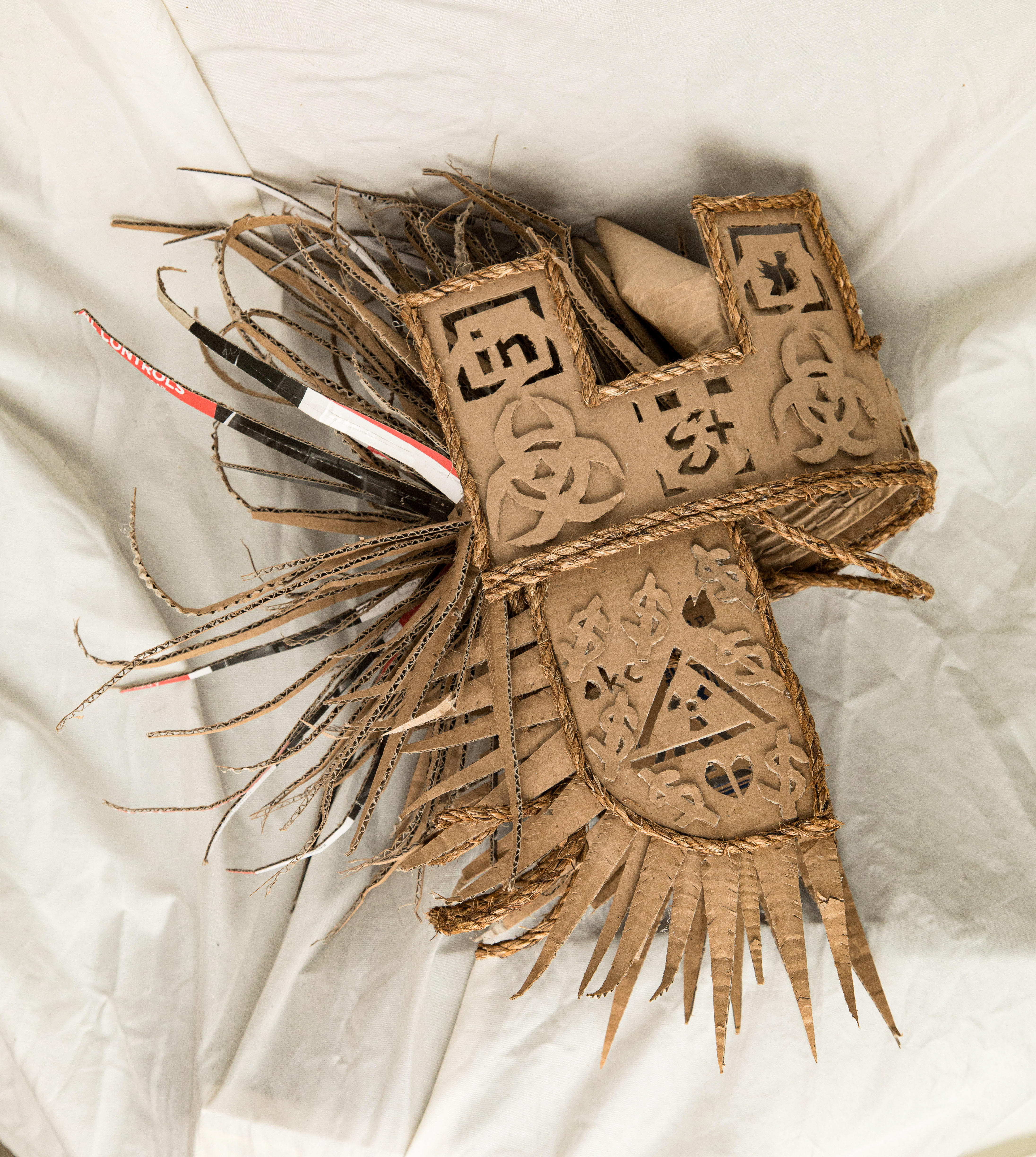 3D cardboard and twine helmet sculpture