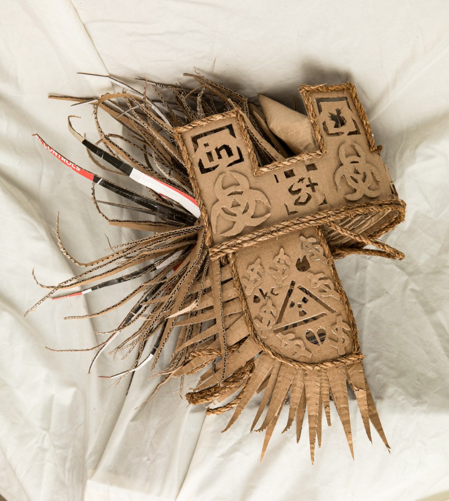 3D cardboard and twine helmet sculpture