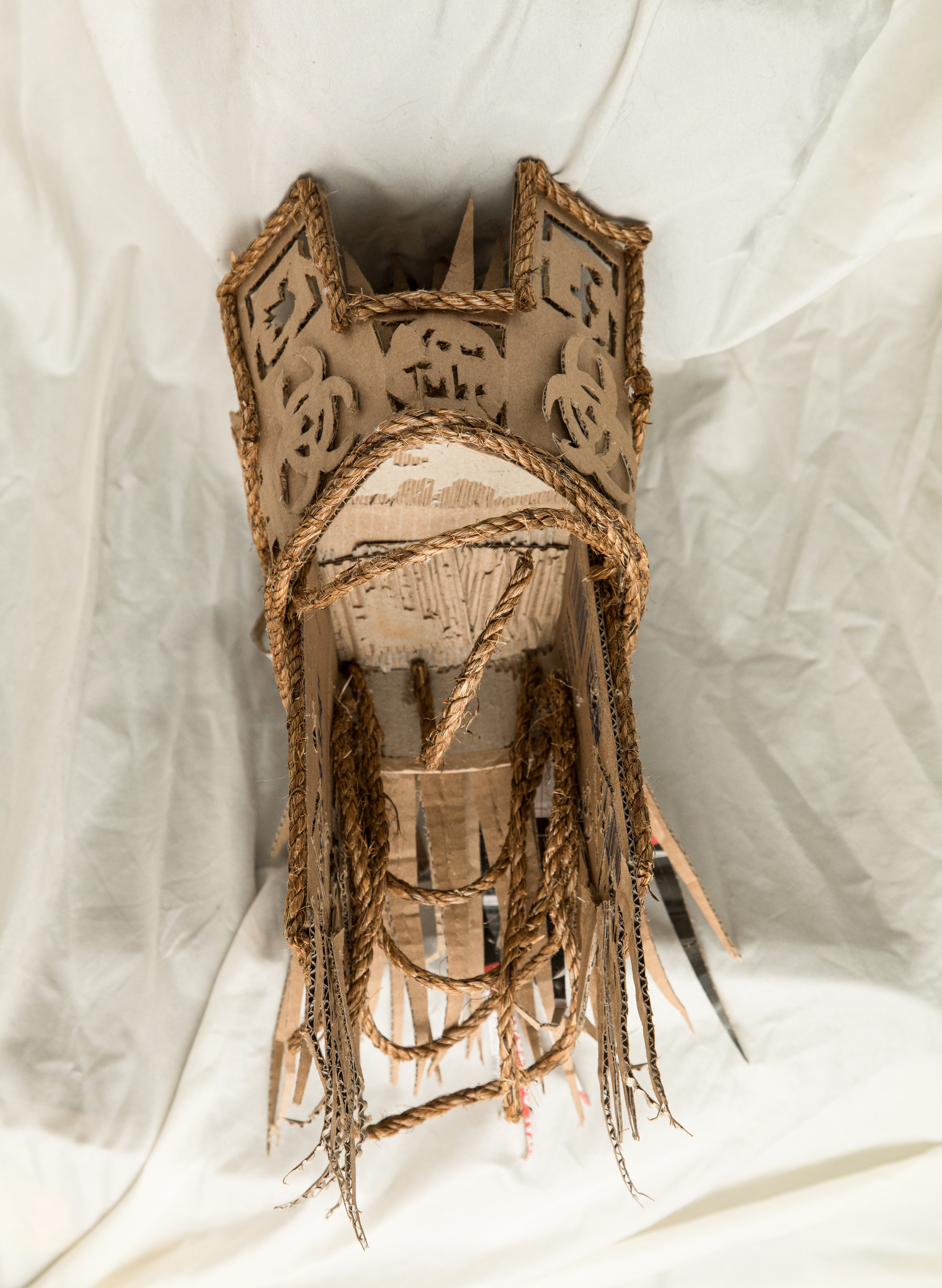 3D cardboard and twine helmet sculpture 