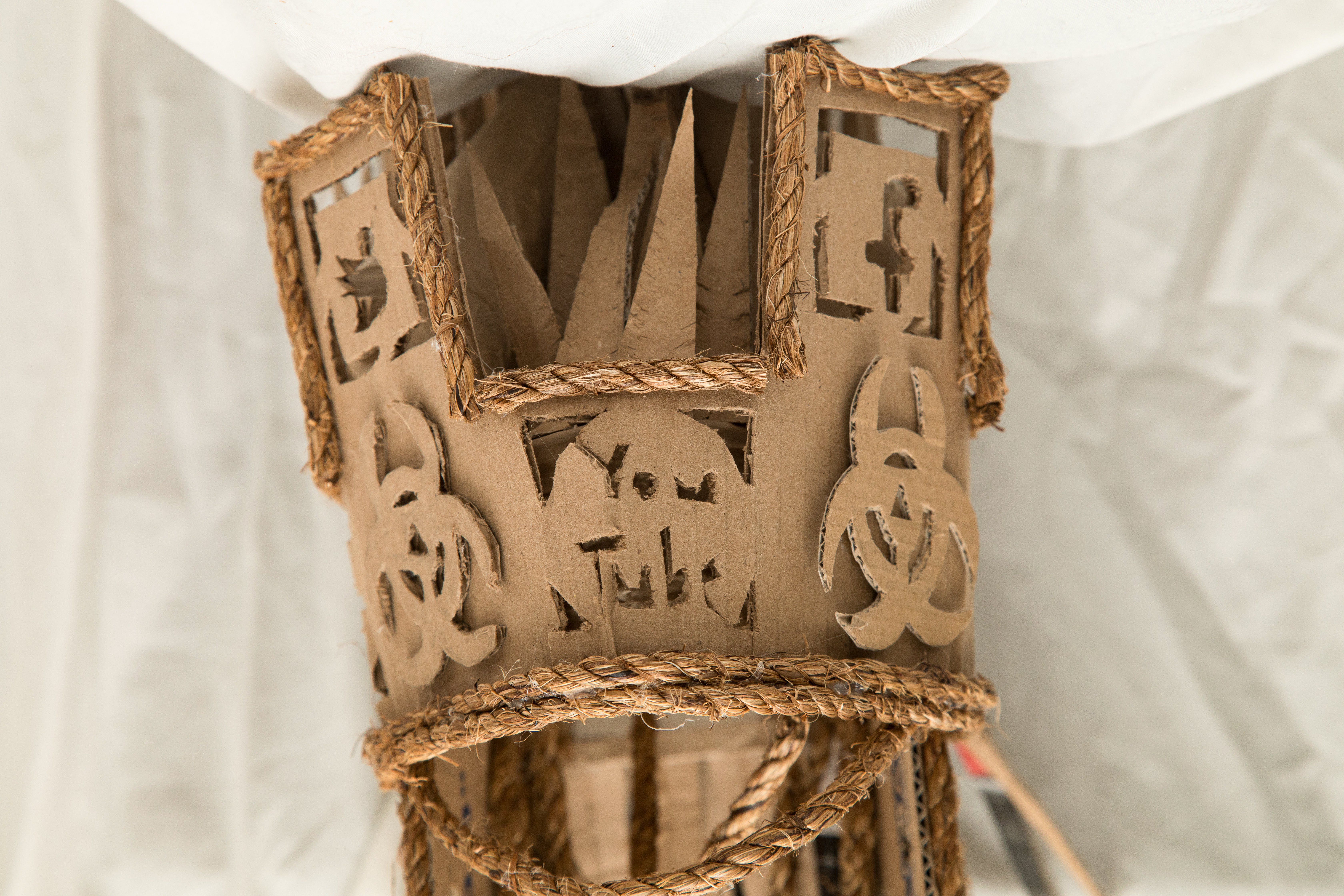 3D cardboard and twine helmet sculpture