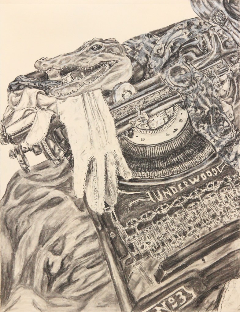 a white glove and a preserved alligator head on top of an antique typewriter